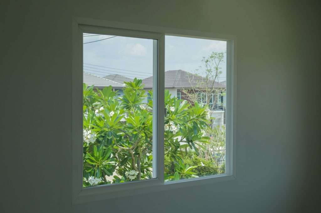 Empty Room With Glass Window Frame House Interior On Concrete Wall professional sliding windows installation and replacement - 9